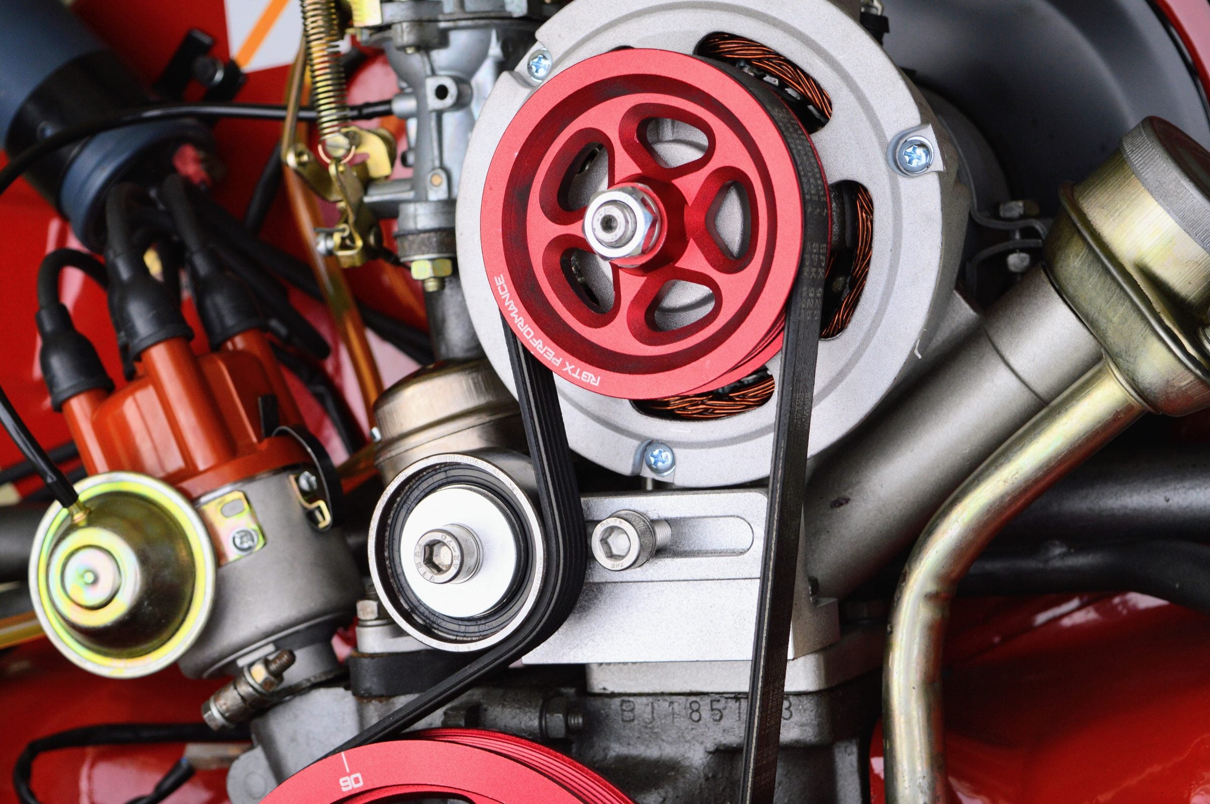 Rebuilt Volkswagen Bus engine showing the crankshaft pulley, alternator and belt drive