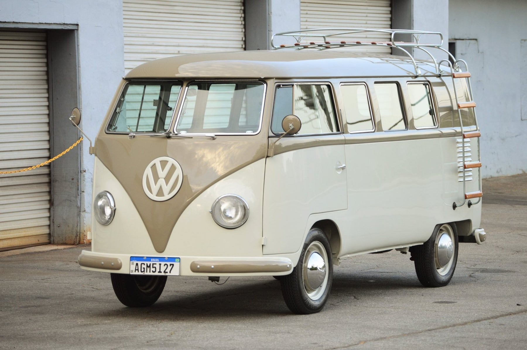 1959 Volkswagen Bus 11-Window Kombi Deluxe in two-tone light gray over dark gray, front three-quarter view