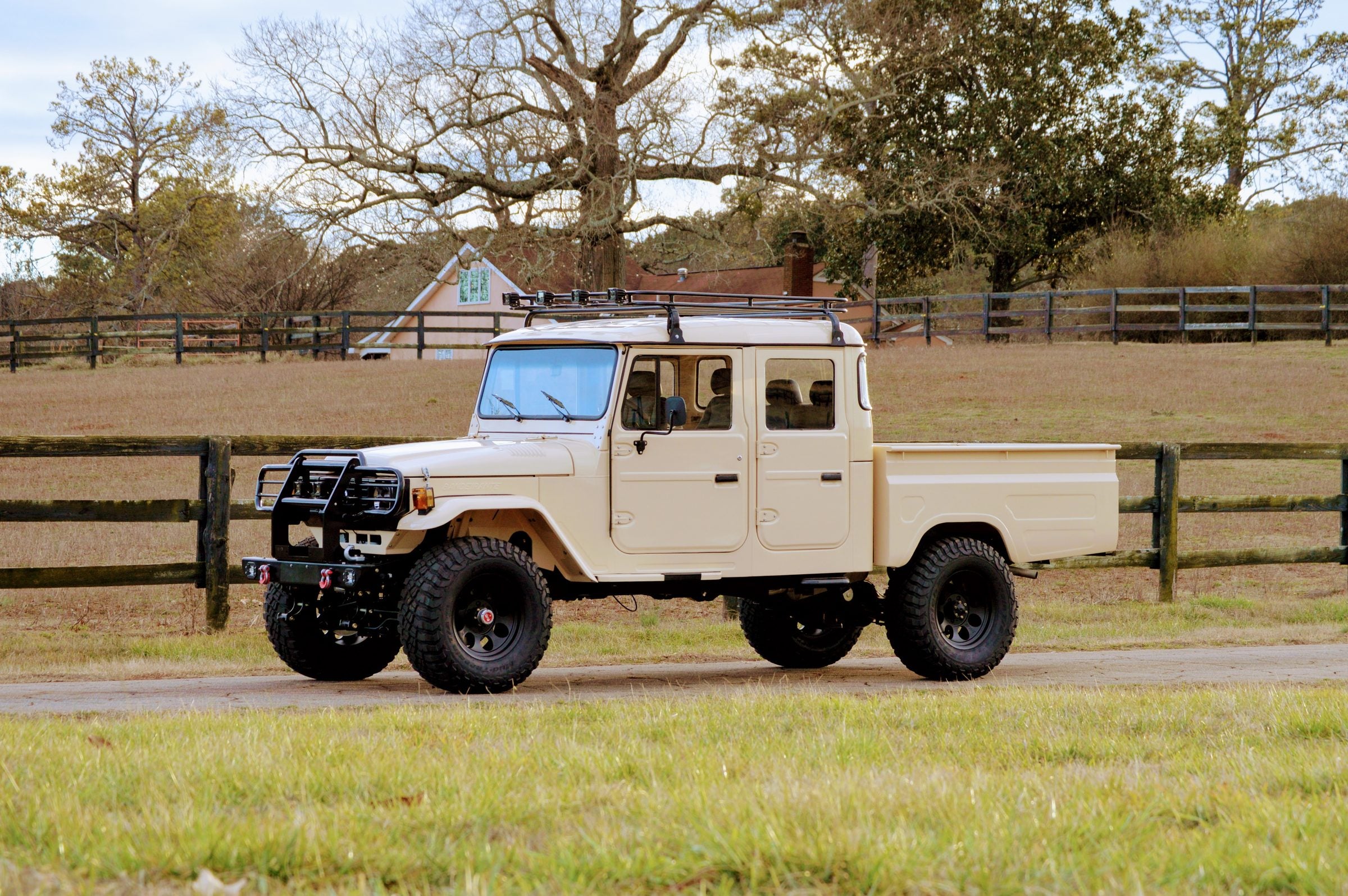 Tan Toyota Bandeirante four-door double cab restored by Overland Imports
